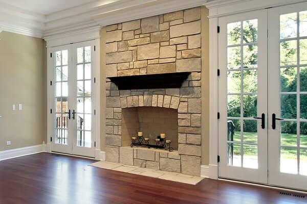 Modern stone mantel fireplace and hearth
