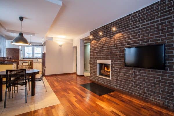 Modern home with brown brick accent wall and fireplace